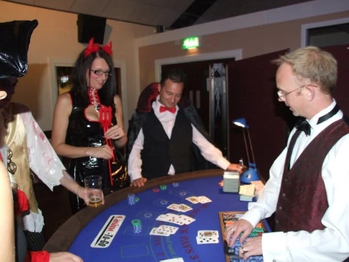 Jamie dealing blackjack at a Halloween fancy dress casino night
