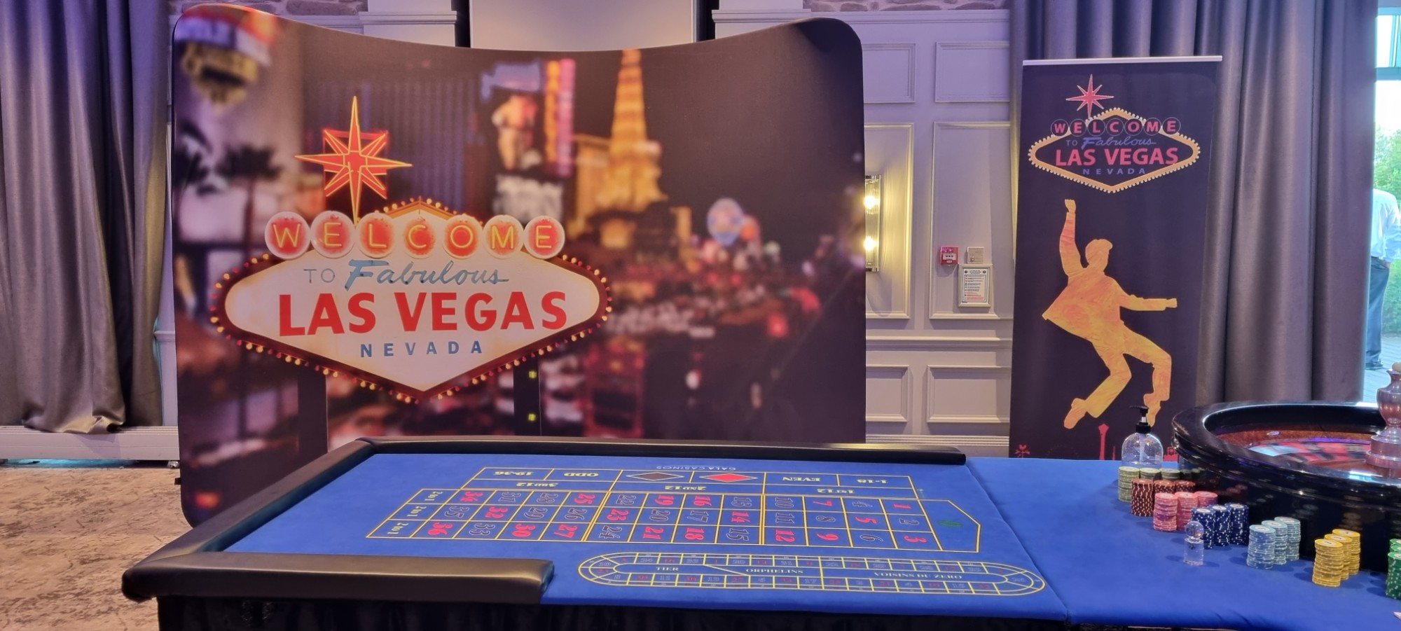 Fun Casino Fun roulette table in front of the Welcome to Fabulous Las Vegas backdrop
