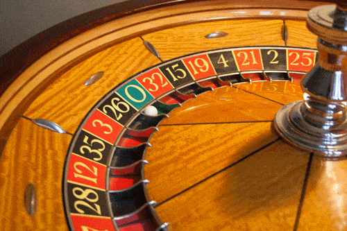 Ball landing on zero on a roulette wheel.