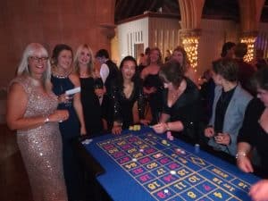 Guests in evening wear playing roulette