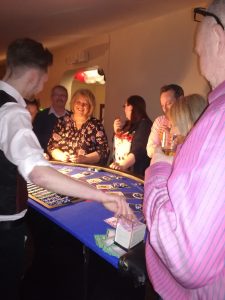 Croupier dealing to guests at a house party casino