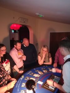 Guests playing blackjack at a casino party