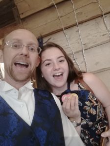 Croupier and a guest smiling for a selfie at an event