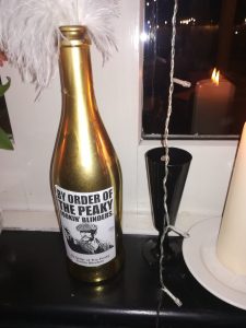 Peaky Blinders themed gold bottle decoration