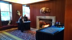 Casino tables set up in a wood-panelled room with an open fire