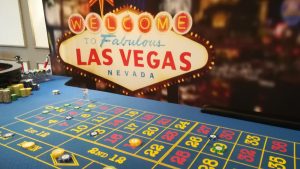Roulette table in front of the Welcome to Fabulous Las Vegas backdrop