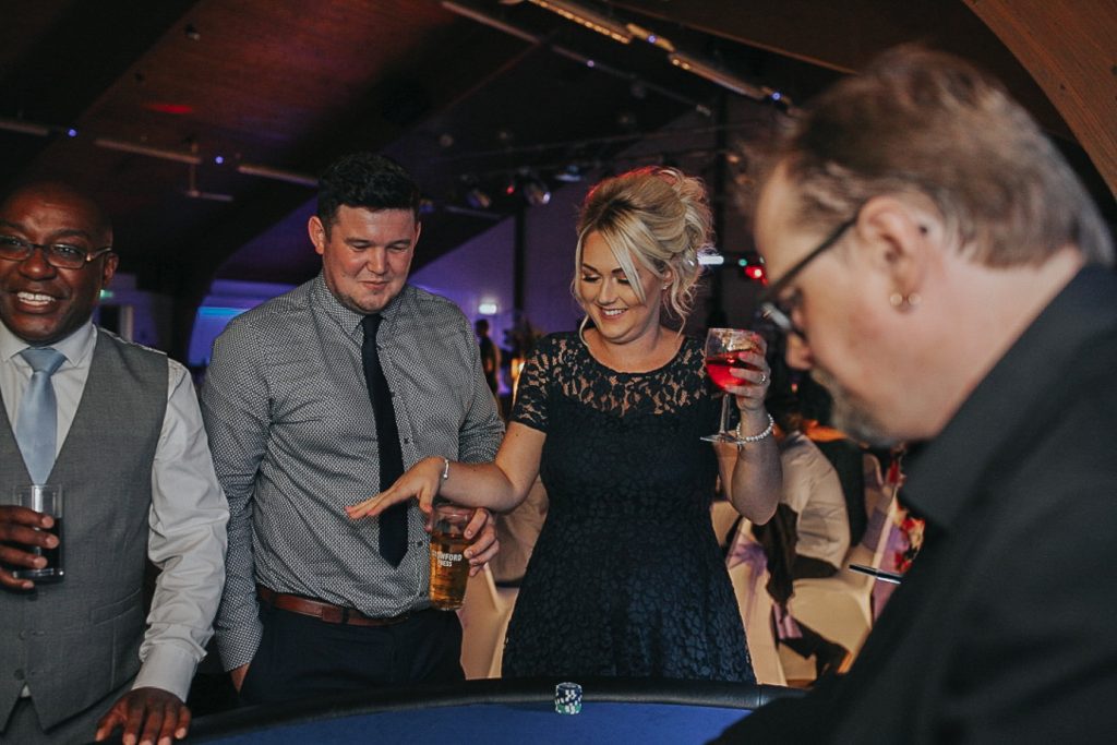 People enjoying a Blackjack Table.