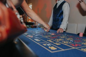 Croupier placing chips on the roulette layout