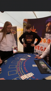 Fun casino hire reviews - guests enjoying a Las Vegas themed blackjack table at a 21st birthday party