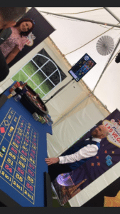 Roulette table and Las Vegas banner in a marquee