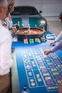Roulette table in a car showroom at a summer ball