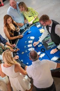 Blackjack table from above with players and dealer