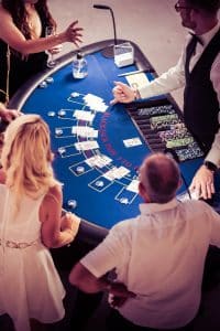 Blackjack table seen from above with players and dealer