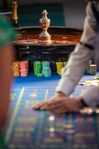 Roulette wheel and coloured chips on the layout