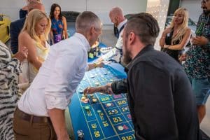Guests placing bets at a roulette table