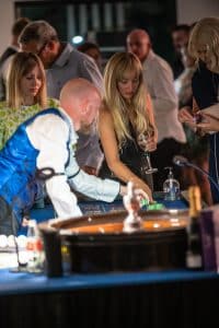 Croupier spinning the roulette wheel for players