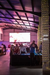 Casino party in a large event hall with screen and lights