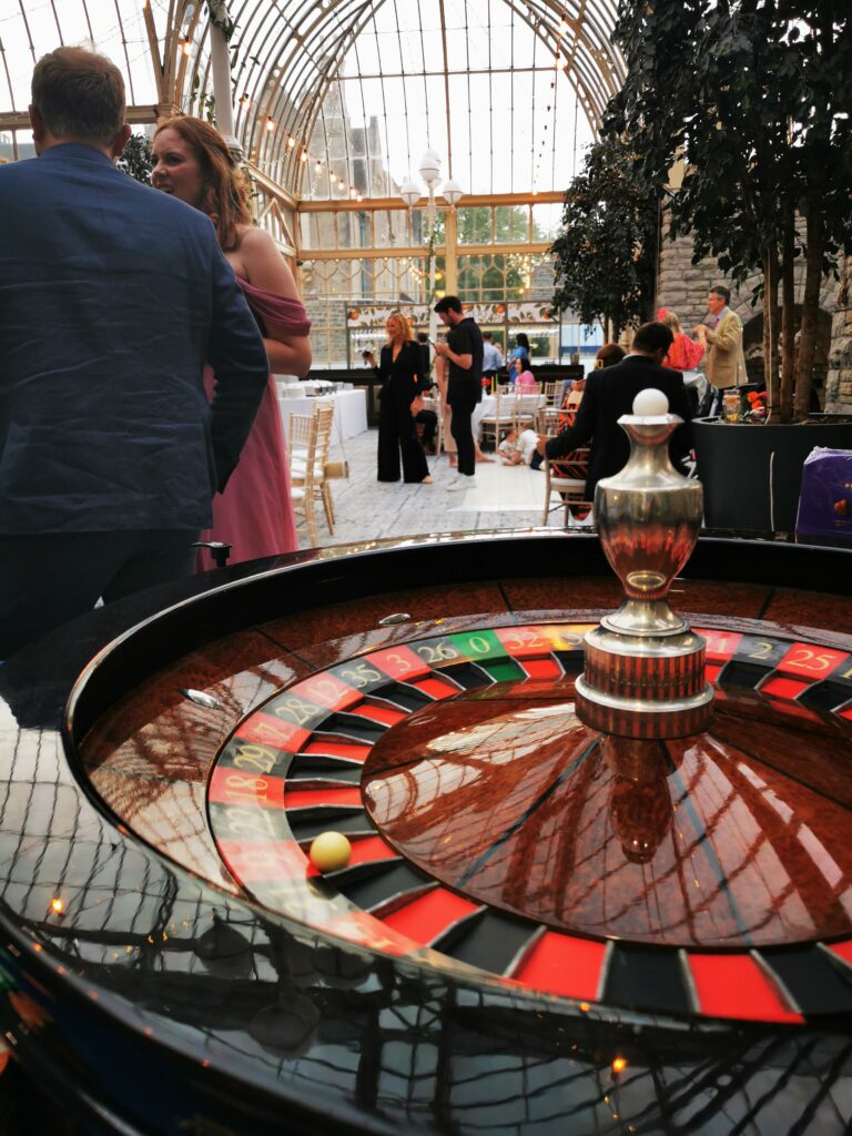 Roulette wheel at a wedding in a glass-roofed venue
