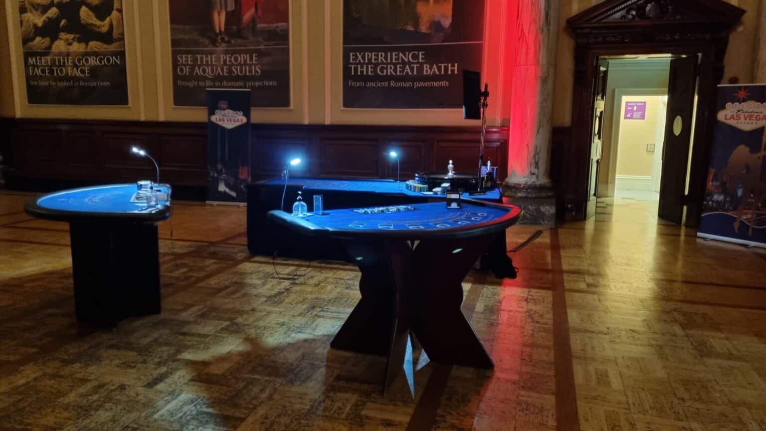 Two blackjack tables set up in a historic hall