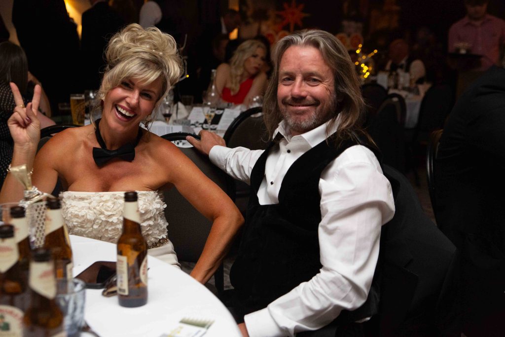Guests in evening wear enjoying the casino