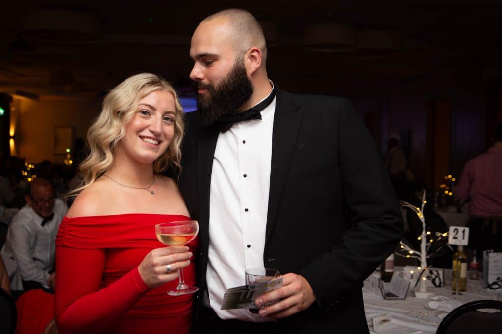 Couple in evening wear at a black tie event