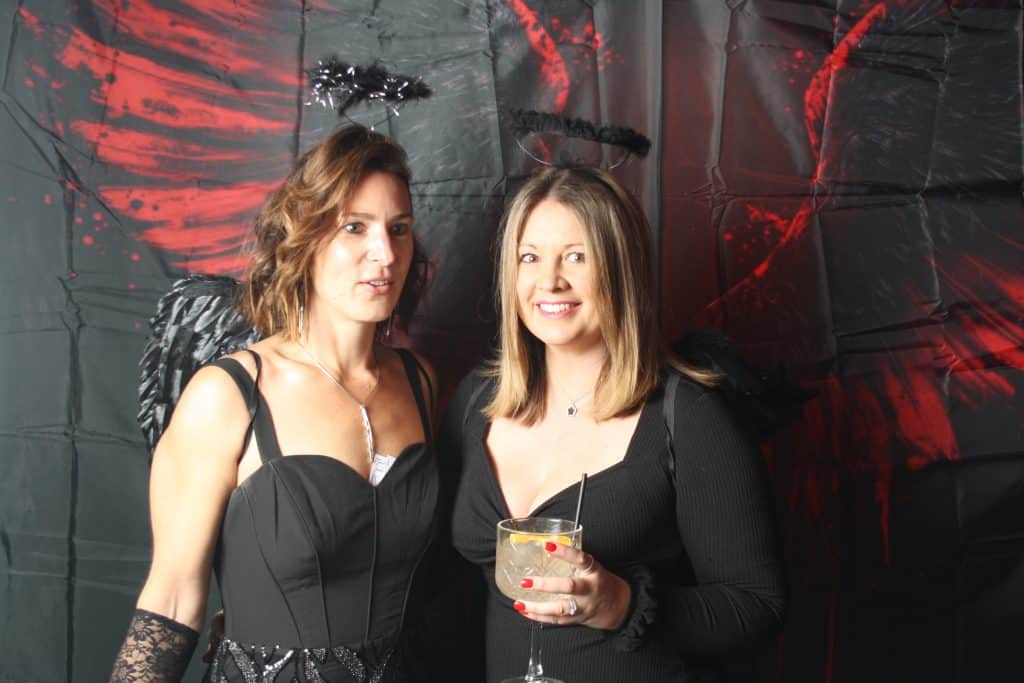 Birthday party guests posing for the open-air photo booth camera