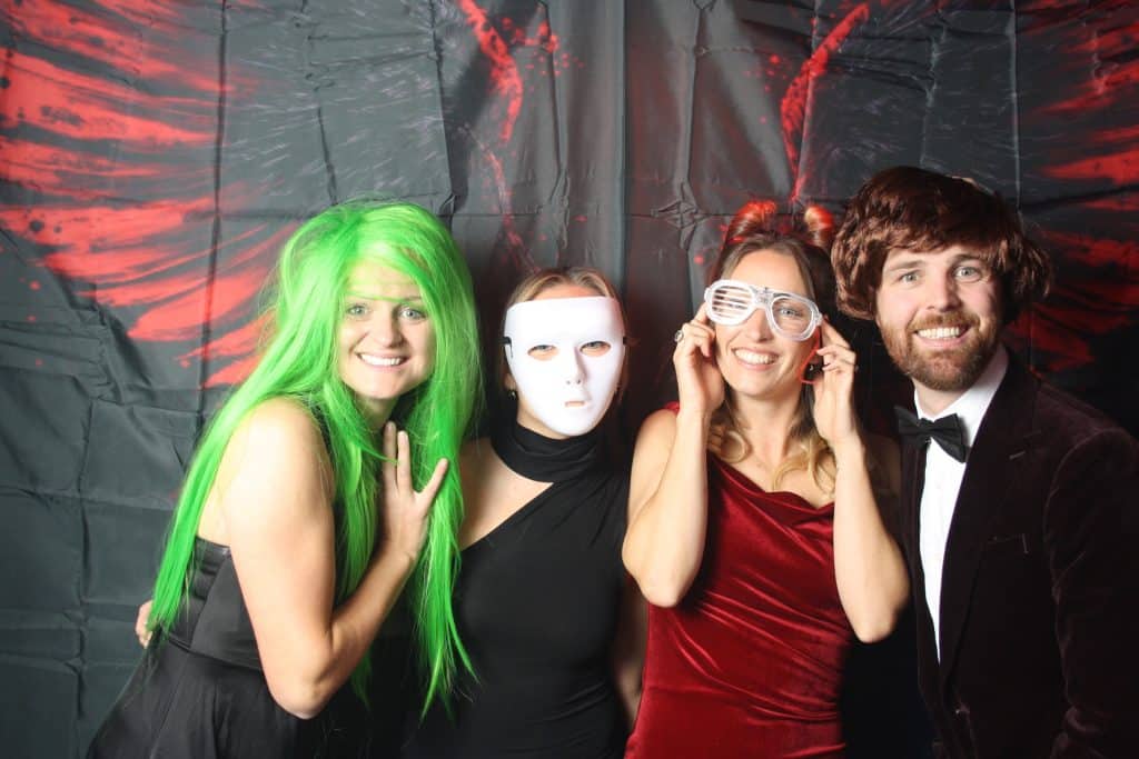 Guests posing with fun props during photo booth hire in Wiltshire at a 40th birthday party