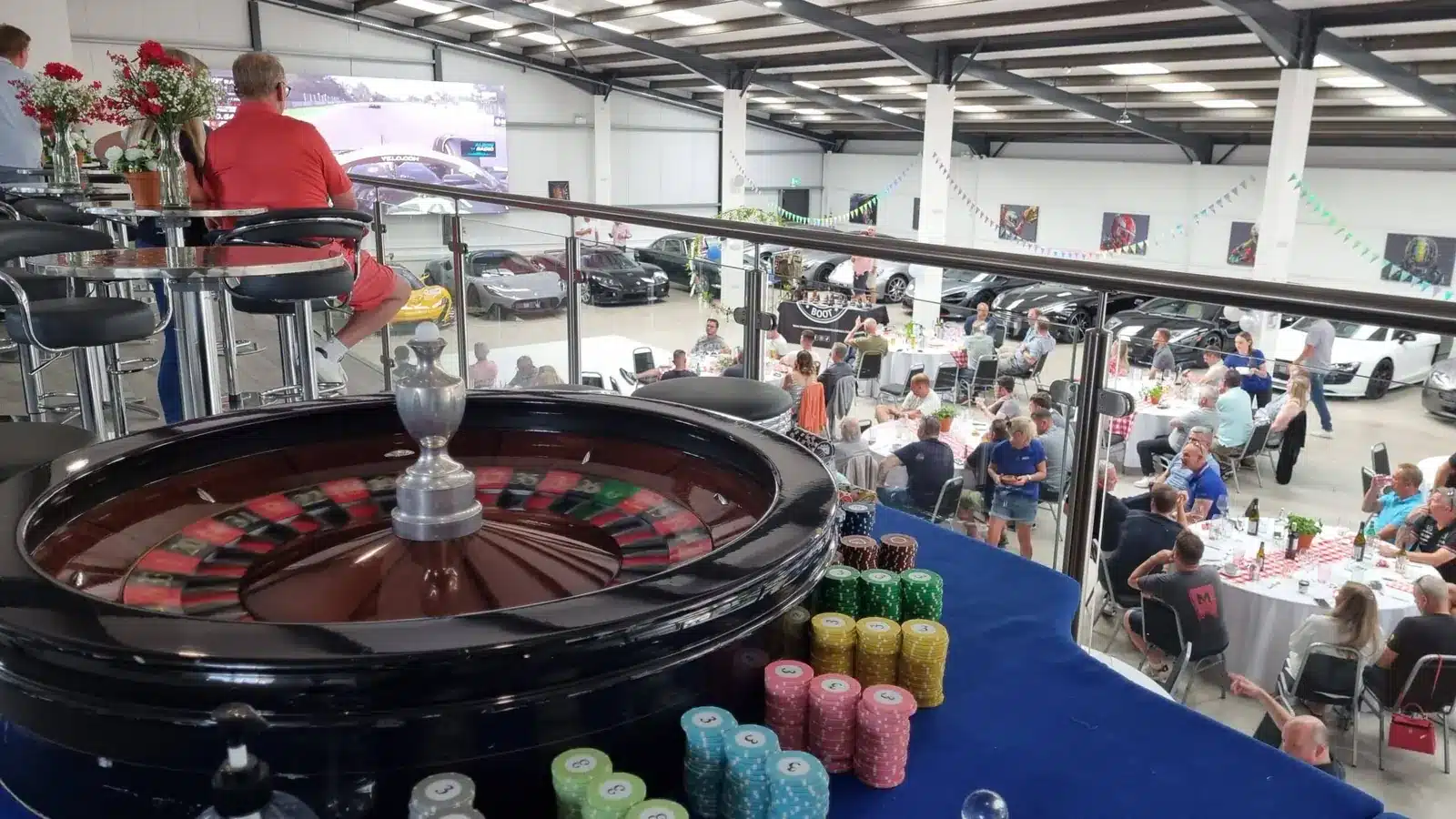 Roulette wheel and chips overlooking a corporate event